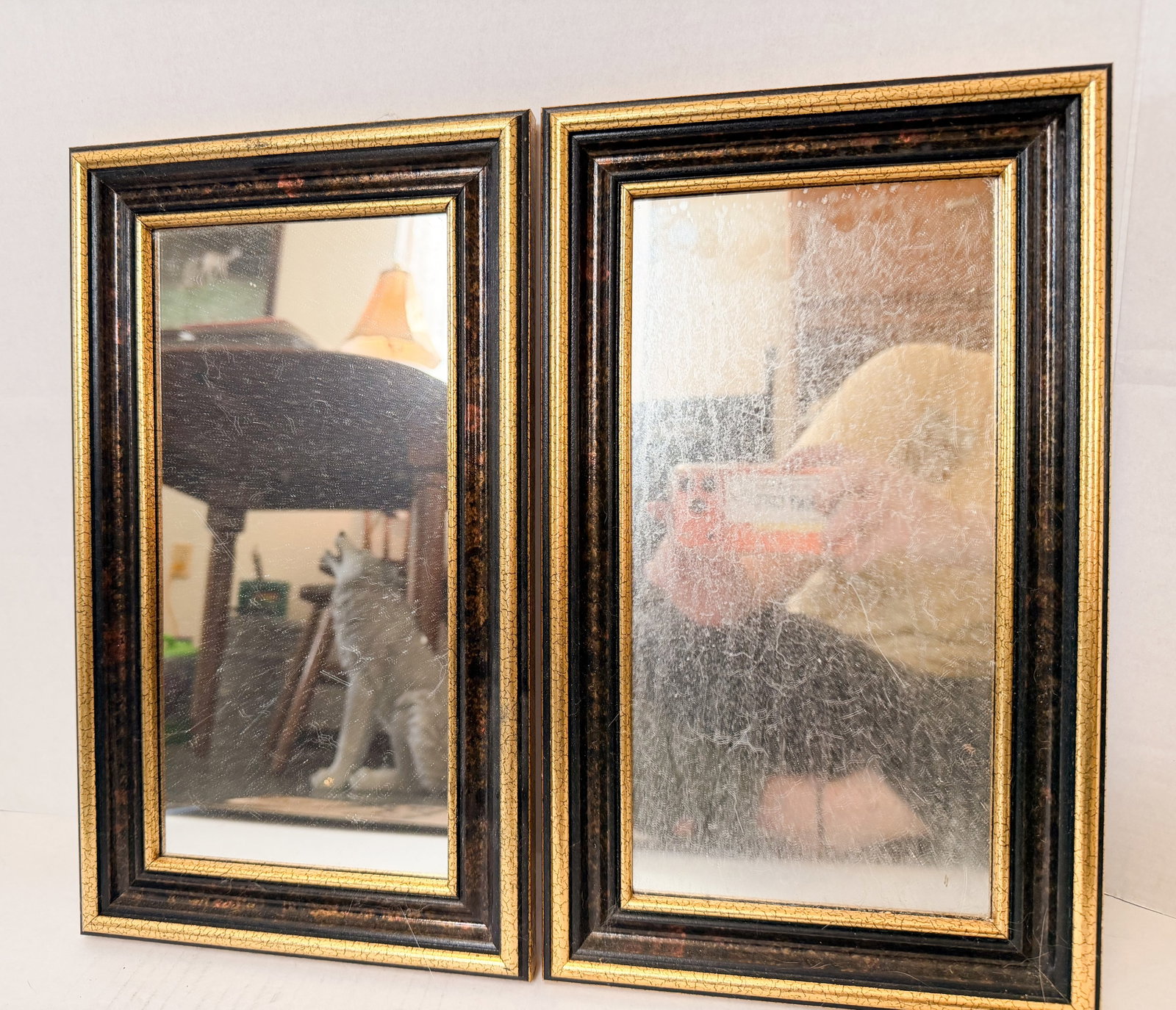 PAIR OF BLACK AND GILT WALL MIRRORS (1 of 1)