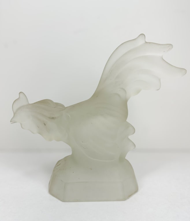 VINTAGE FROSTED GLASS ROOSTER FIGURINE: A vintage stylized rooster figurine crafted in molded frosted glass. The bird is depicted in a standing posture atop a faceted octagonal base and displays a vertical mold seam.