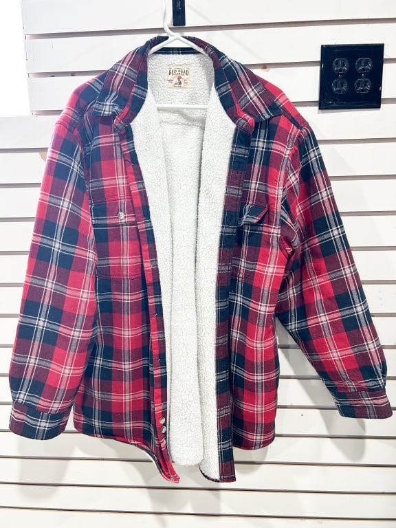 RED HEAD BRAND CO. SHERPA-LINED FLANNEL: A Red Head Brand Co. plaid flannel shirt-jacket featuring a red, black, and white woven exterior and a white faux-sherpa lining. A woven label at the inner neck reads Reg. T.M. RED HEAD BRAND CO. Auth