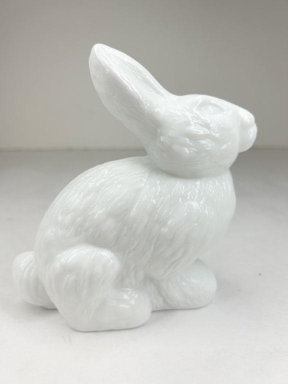 MOSSER MILK GLASS STANDING RABBIT: A standing rabbit figurine crafted in white milk glass. The piece features a textured fur finish and a fire-polished glossy surface.