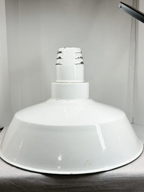 LARGE WHITE ENAMEL INDUSTRIAL PENDANT SHADE: A vintage industrial reflector lampshade constructed of heavy-gauge spun steel with a white vitreous enamel finish. The shade features a stepped neck design with a textured orange-peel interior