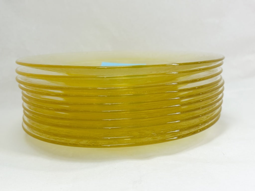SET OF TEN YELLOW DEPRESSION GLASS LUNCH PLATES: A set of ten yellow translucent glass plates featuring an all-over acid-etched pattern of floral sprays, scrolls, and basket-weave motifs on the rims and centers. The plates are consistent with the Lo