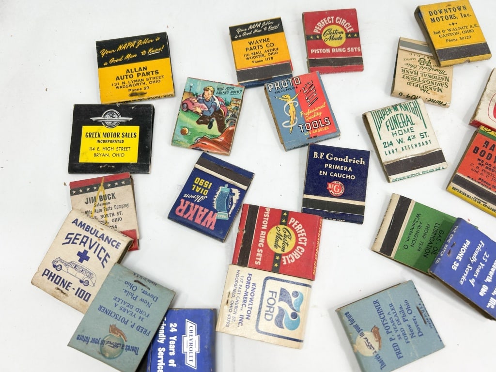 COLLECTION OF VINTAGE OHIO ADVERTISING MATCHBOOK COVERS: A collection of vintage advertising matchbook covers, primarily printed on cardstock and featuring mid-20th-century automotive and regional Ohio businesses. Readable maker marks include The Ohio Match