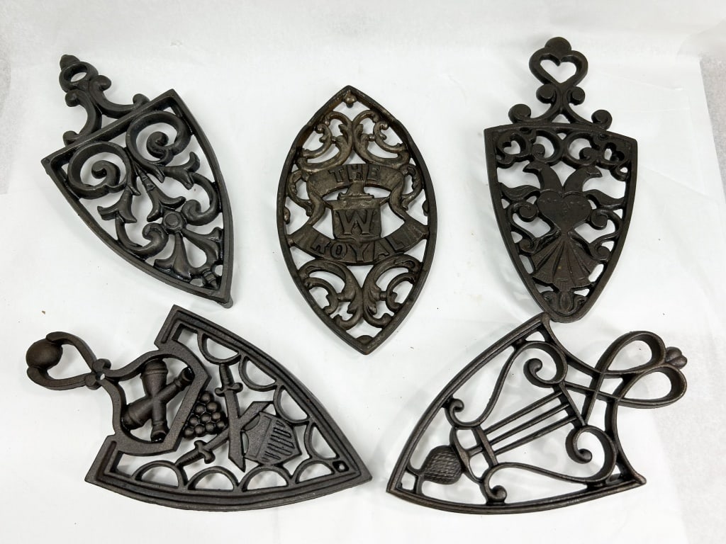 THE ROYAL W AND ASSORTED CAST IRON TRIVETS (1 of 7)