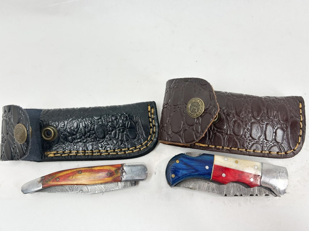 TWO DAMASCUS STEEL FOLDING KNIVES (1 of 2)