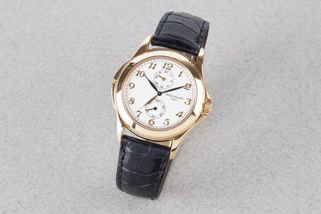 PATEK PHILIPPE CALATRAVA TRAVEL TIME 18CT GOLD REF. 5134J-001: PATEK PHILIPPE CALATRAVA TRAVEL TIME 18CT GOLD REF. 5134J-001, this watch is a ref. 5134J-001 and is fitted with a circular white dial with hour markers and hands. The 37mm 18ct gold case is fitted