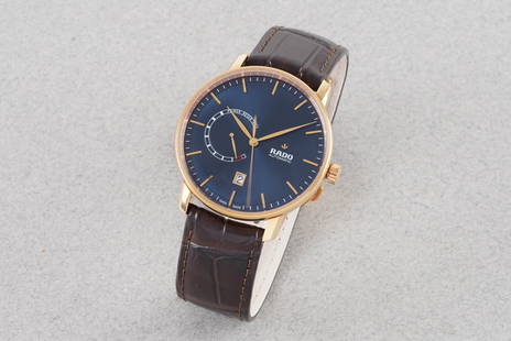 *TO BE SOLD WITHOUT RESERVE* RADO COUPOLE AUTOMATIC W/ BOX & PAPERS REF. 77238792: *TO BE SOLD WITHOUT RESERVE* RADO COUPOLE AUTOMATIC W/ BOX & PAPERS REF. 77238792, this watch is a ref. 77238792 and is fitted with a circular blue dial with hour markers and hands. The 39mm gold