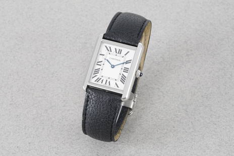 CARTIER TANK SOLO W/ GUARANTEE REF. 3169 CIRCA 2019: CARTIER TANK SOLO W/ GUARANTEE REF. 3169 CIRCA 2019, this watch is a ref. 3169 and is fitted with a rectangular dial with hour markers and hands. The 28x35mm stainless steel case is fitted with a
