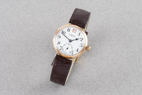 *TO BE SOLD WITHOUT RESERVE* ASPREY 9CT GOLD TRENCH WATCH: *TO BE SOLD WITHOUT RESERVE* ASPREY 9CT GOLD TRENCH WATCH, this watch is fitted with a circular white dial with hour markers and hands. The 32mm 9ct gold case is fitted with a crown and a case back.