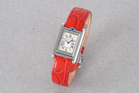 CARTIER TANK BASCULANTE REF. 2386: CARTIER TANK BASCULANTE REF. 2386, this watch is a ref. 2386 and is fitted with a rectangular ivory dial with hour markers and hands. The 22x32mm stainless steel case is fitted with a crown and a
