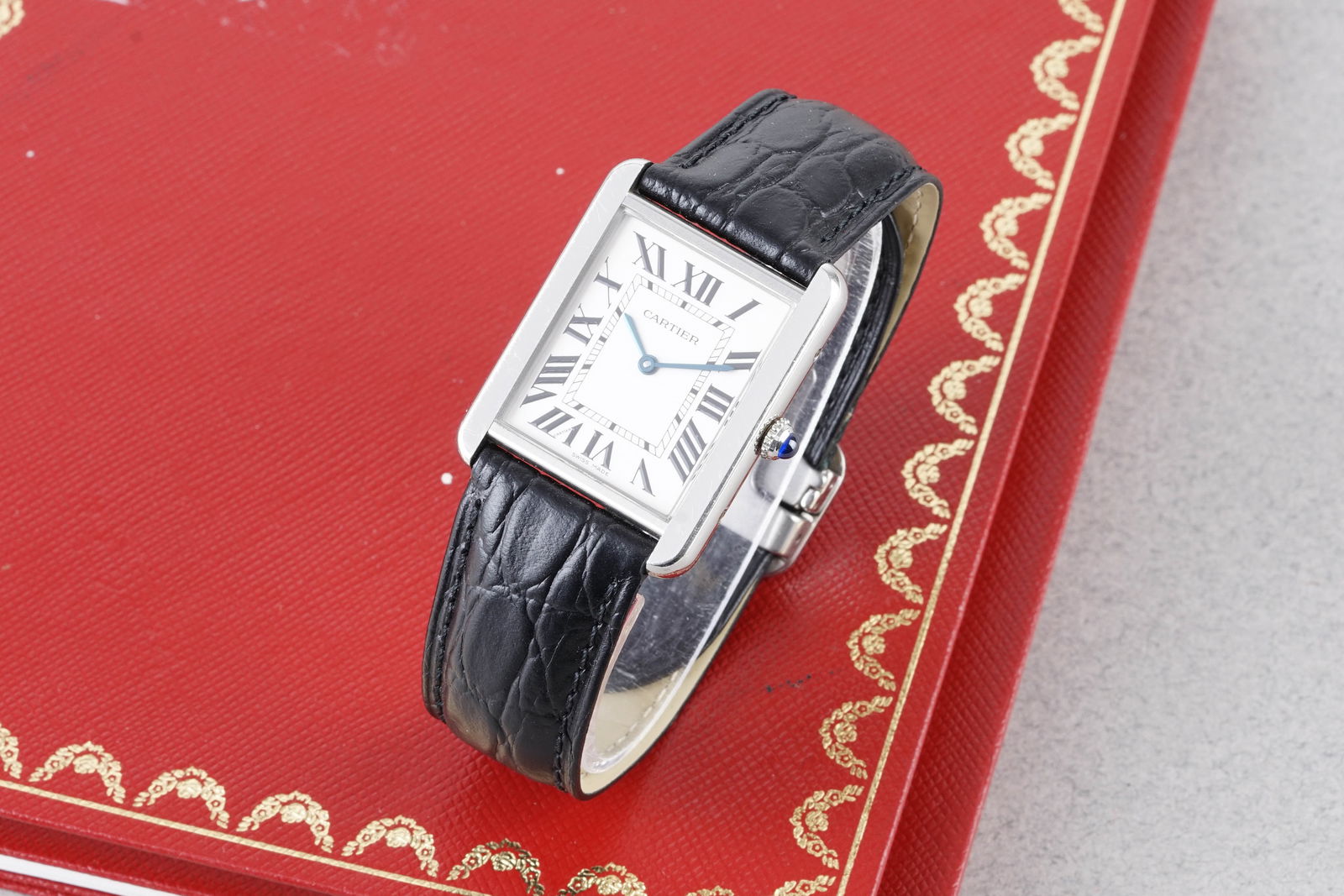 CARTIER TANK SOLO W/ GUARANTEE REF. 3169 CIRCA 2011: CARTIER TANK SOLO W/ GUARANTEE REF. 3169 CIRCA 2011, this watch is a ref. 3169 and is fitted with a rectangular dial with roman numeral hour markers and hands. The 27x35mm case is fitted with a