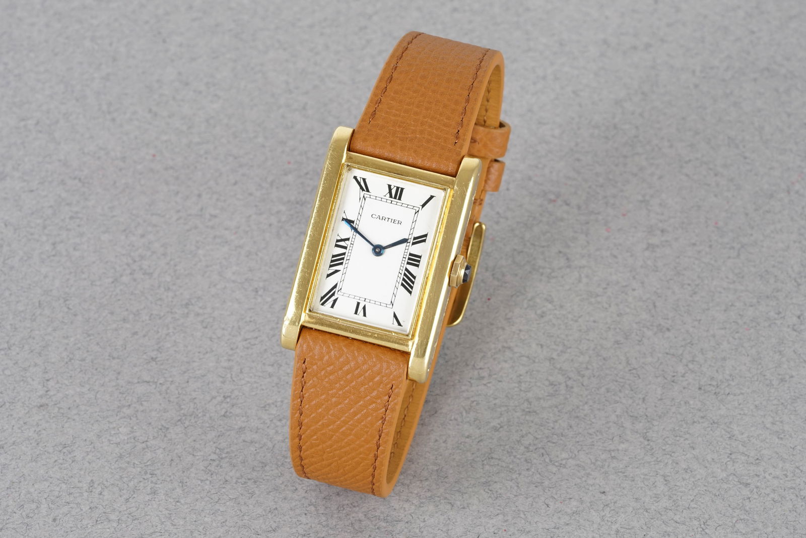 EXCEEDINGLY RARE CARTIER TANK MAGNUM XL EDOUARD JAEGER 18CT YELLOW GOLD CIRCA 1931: EXCEEDINGLY RARE CARTIER TANK MAGNUM XL EDOUARD JAEGER 18CT YELLOW GOLD CIRCA 1931, this watch is fitted with a rectangular white dial with hour markers and hands. The 25x37.5mm 18ct gold case is fitt