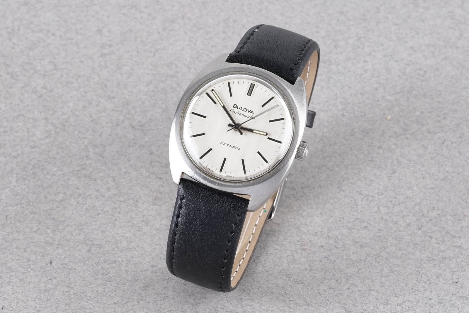 BULOVA AMBASSADOR AUTOMATIC REF. 7312: BULOVA AMBASSADOR AUTOMATIC REF. 7312, this watch is a ref. 7312 and is fitted with a circular silver dial with applied stick hour markers and hands. The 36mm stainless steel case is fitted with a