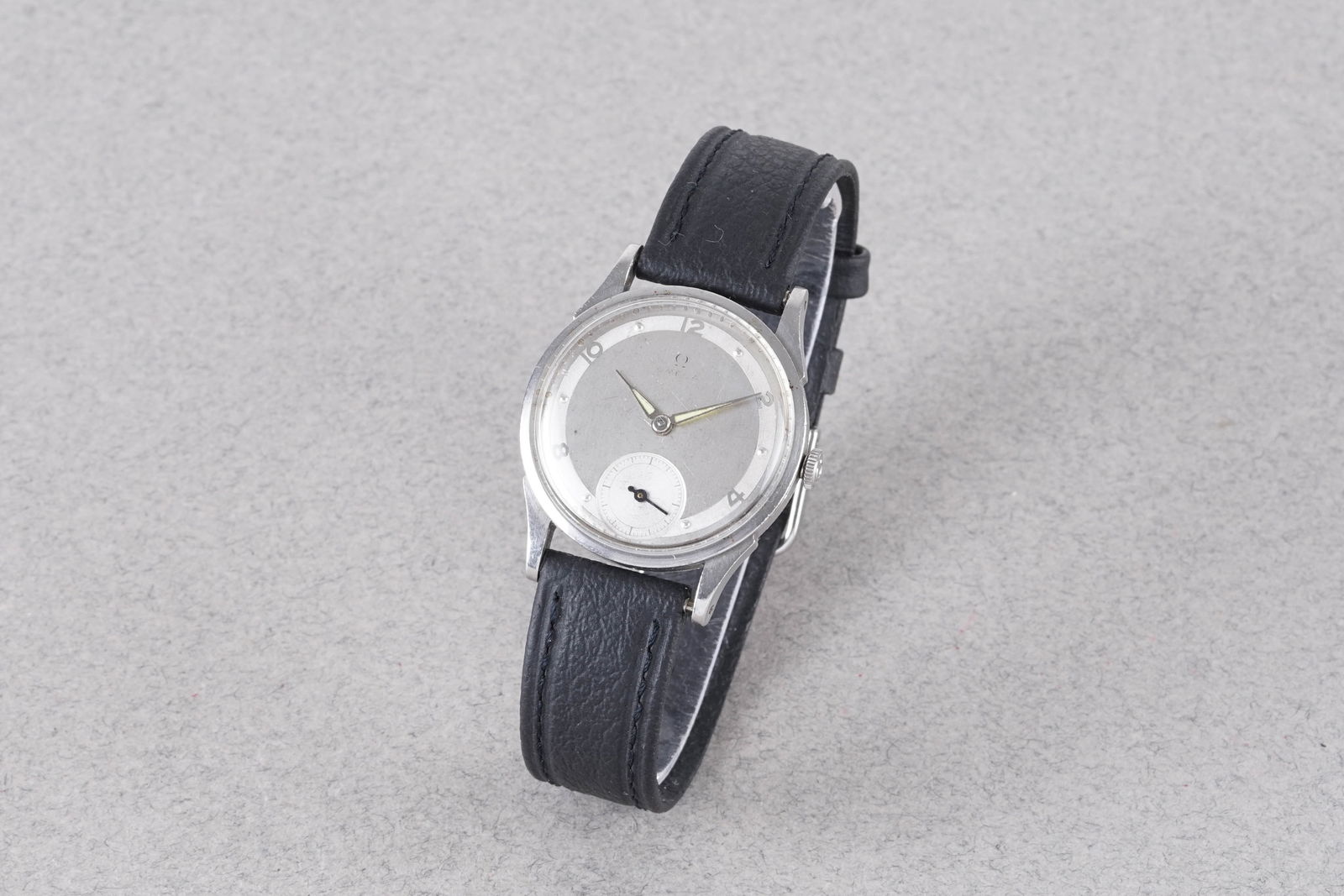 OMEGA TWO TONE WRISTWATCH REF. 2413-3 CIRCA 1945: OMEGA TWO TONE WRISTWATCH REF. 2413-3 CIRCA 1945, this watch is a ref. 2413-3 and is fitted with a circular silver two tone dial with a subsidiary dial at 6 o'clock, arabic and dot hour markers and