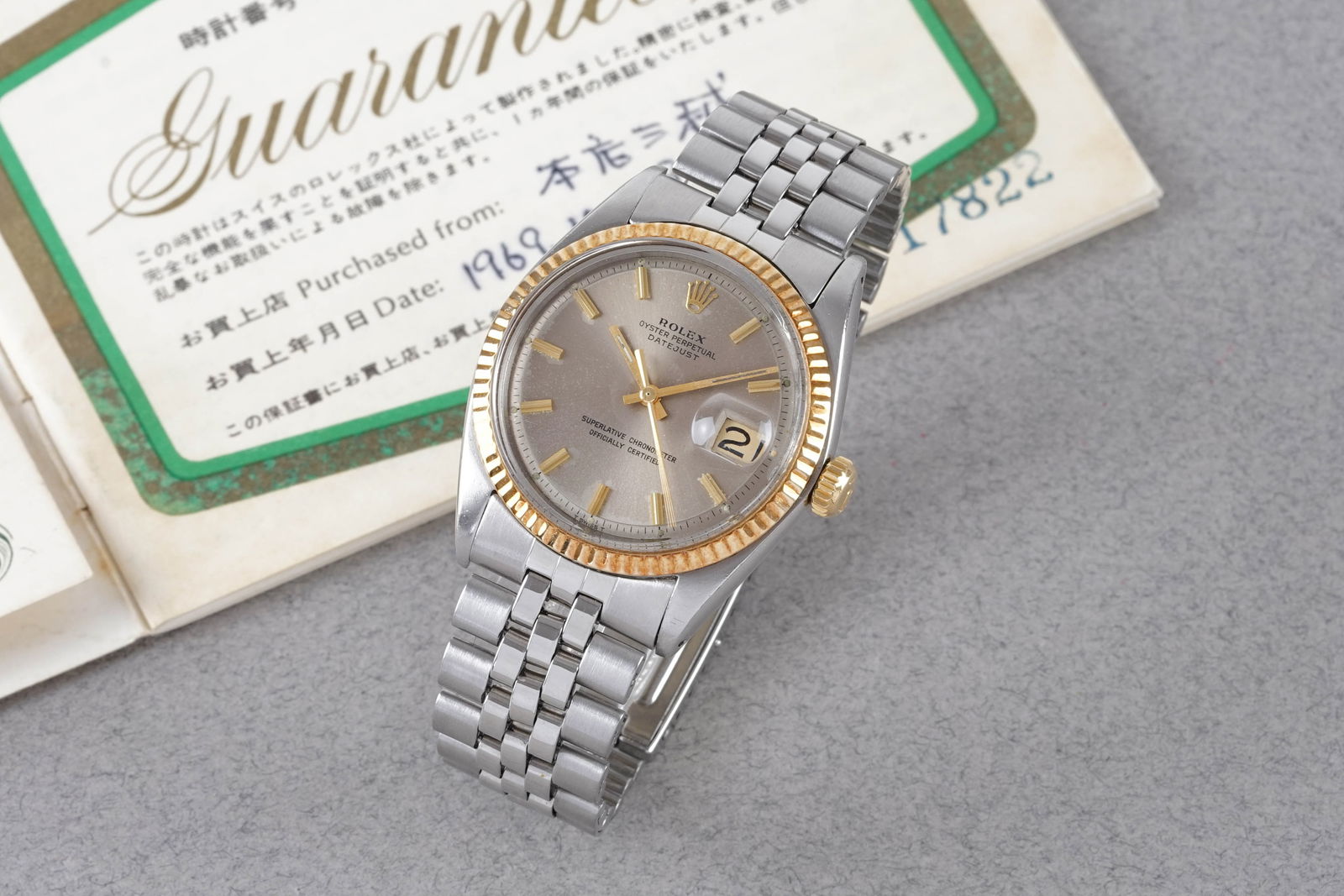 ROLEX OYSTER PERPETUAL DATEJUST STEEL & GOLD W/ GUARANTEE PAPERS REF. 1601 CIRCA 1969: ROLEX OYSTER PERPETUAL DATEJUST STEEL & GOLD W/ GUARANTEE PAPERS REF. 1601 CIRCA 1969, this watch is a ref. 1601 and is fitted with a circular grey dial with a date window, gold hour markers and h