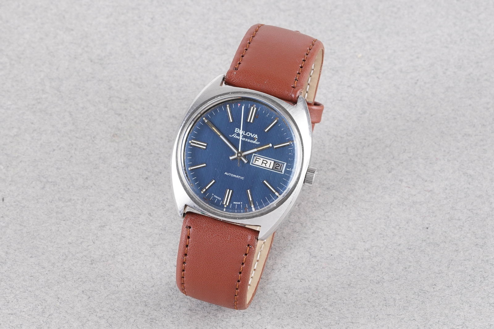 BULOVA AMBASSADOR AUTOMATIC REF. 7532: BULOVA AMBASSADOR AUTOMATIC REF. 7532, this watch is a ref. 7532 and is fitted with a circular blue dial with applied stick hour markers, day and date windows and hands. The 36mm stainless steel case
