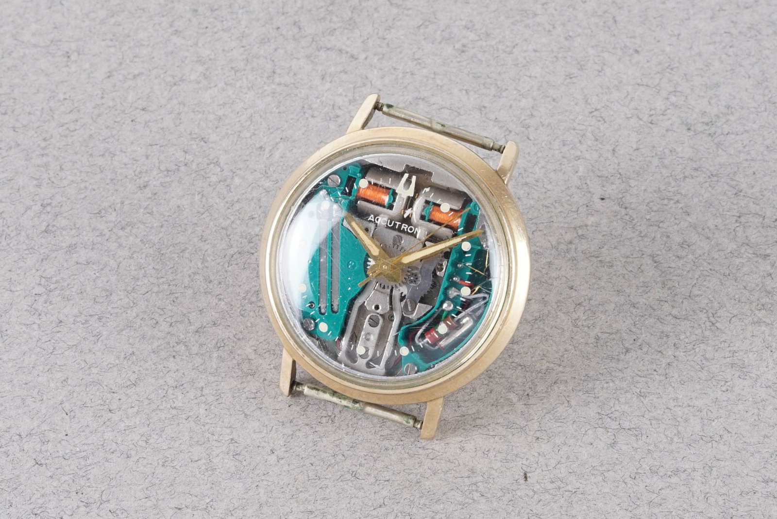 BULOVA ACCUTRON WRISTWATCH: BULOVA ACCUTRON WRISTWATCH, this watch is fitted with a skeleton dial with hour markers and hands. The case is fitted with a flush case back crown and a case back. Inside is a batter powered elec