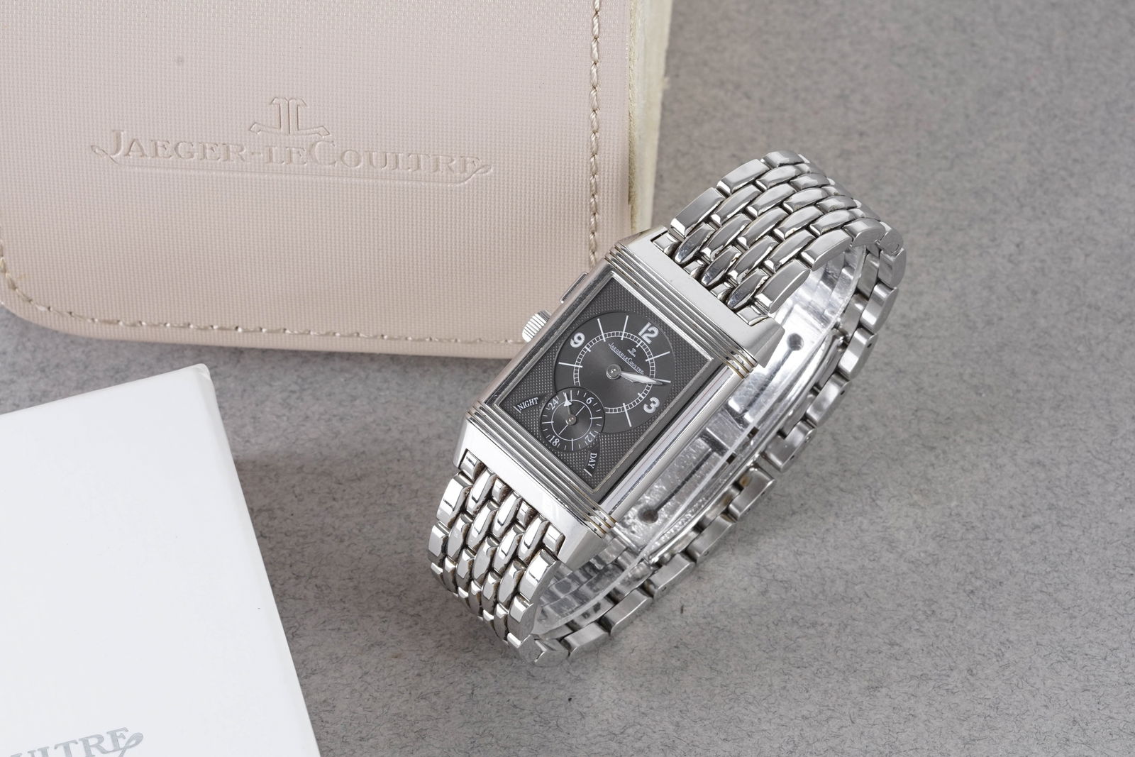 JAEGER LE-COULTRE NIGHT & DAY DUO FACE W/ BOX REF. 272.8.54: JAEGER LE-COULTRE NIGHT & DAY DUO FACE W/ BOX REF. 272.8.54, this watch is a ref. 272.8.54 and is fitted with a duo face dials with hour markers and hands. The 26x42mm stainless steel case is