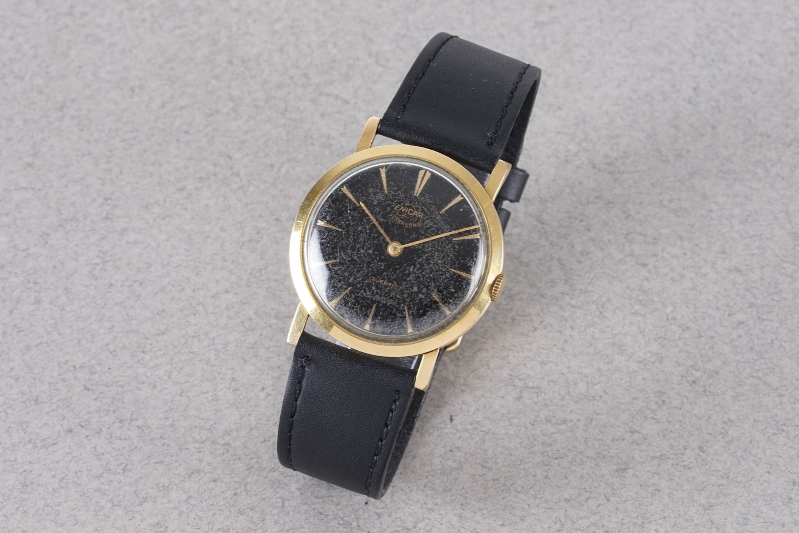ENICAR ULTRASONIC GOLD PLATED WRISTWATCH: ENICAR ULTRASONIC GOLD PLATED WRISTWATCH, this watch is a ref. and is fitted with a circular dial with hour markers and hands. The mm case is fitted with a crown and a case back. Inside is a movement