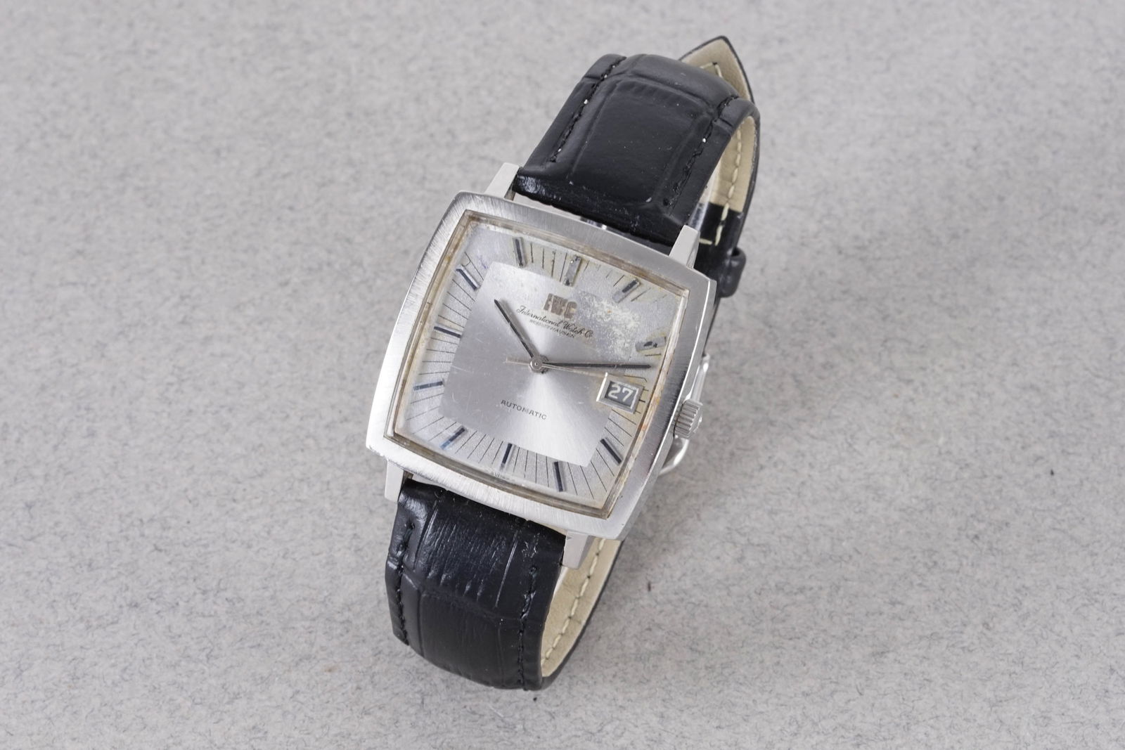 IWC SCHAFFHAUSEN TV AUTOMATIC DATE REF. R1161AD CIRCA 1970S: IWC SCHAFFHAUSEN TV AUTOMATIC DATE REF. R1161AD CIRCA 1970S, this watch is a ref. R1161AD and is fitted with a sqaure silver dial with a date window, hour markers and hands. The 34mm