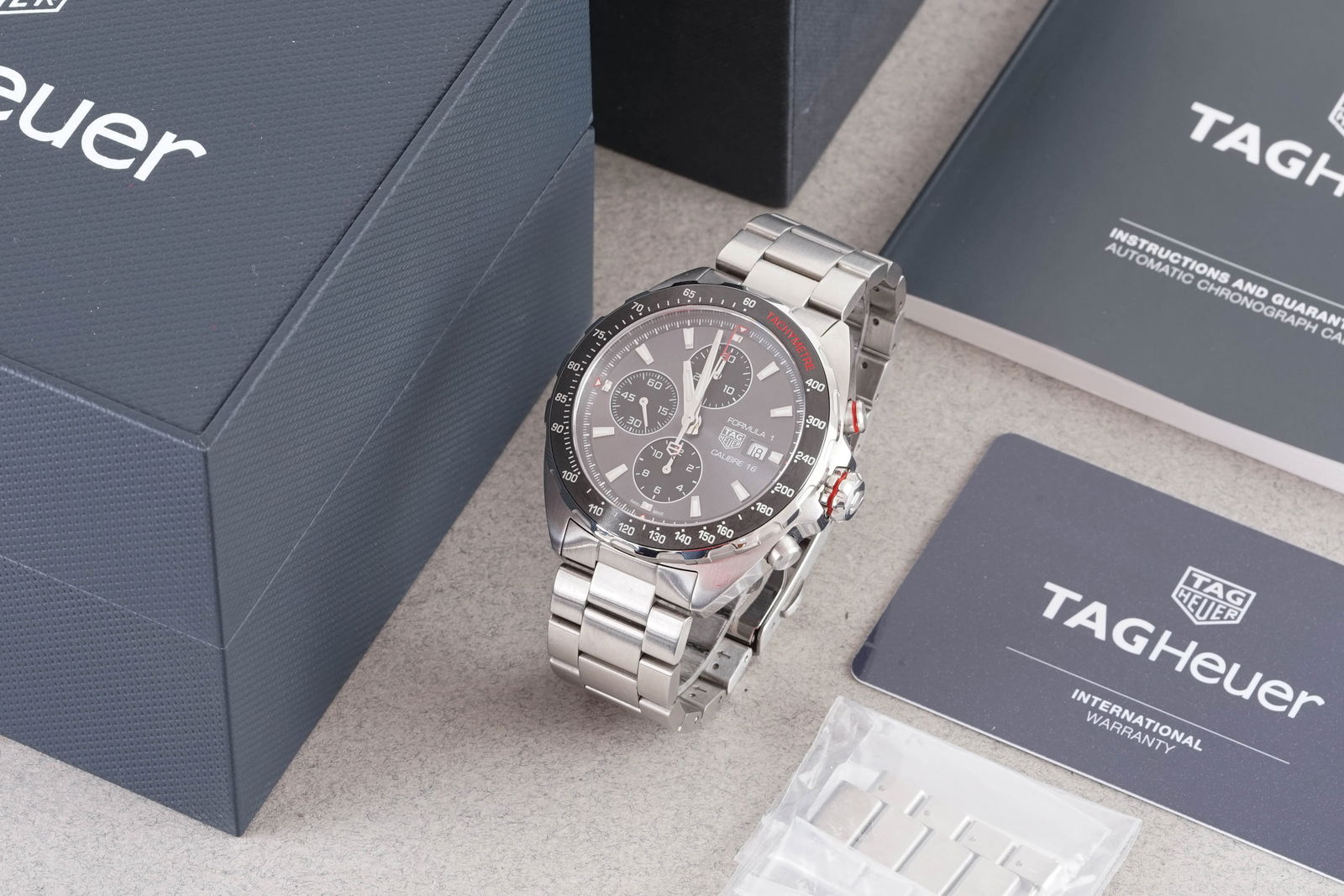 TAG HEUER FORMULA 1 CALIBRE 16 AUTOMATIC CHRONOGRAPH W/ BOX & GUARANTEE PAPERS REF. CAZ2012 CIRCA 20: TAG HEUER FORMULA 1 CALIBRE 16 AUTOMATIC CHRONOGRAPH W/ BOX & GUARANTEE PAPERS REF. CAZ2012 CIRCA 2019, this watch is a ref. CAZ2012 and is fitted with a circular grey triple register dial with a