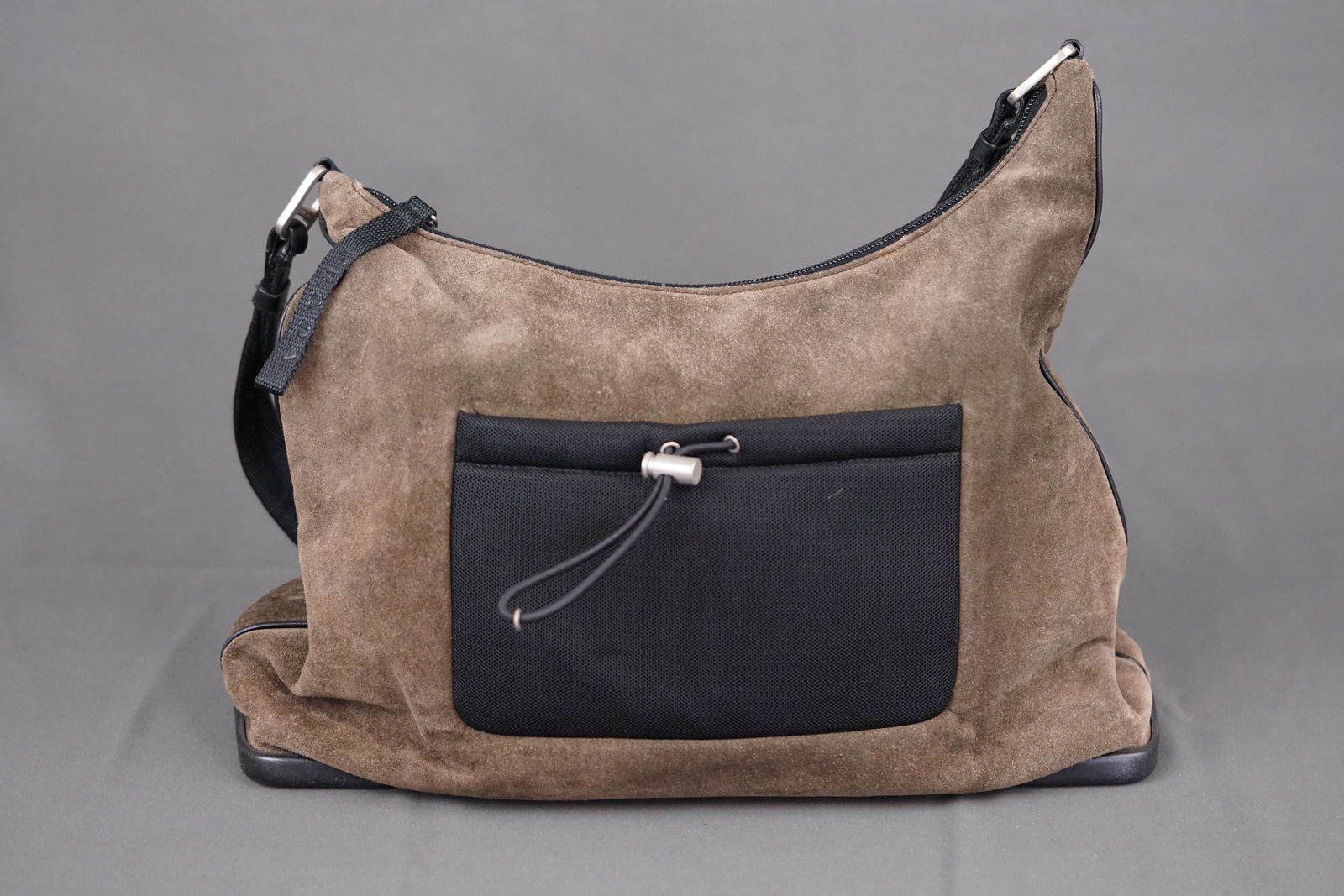PRADA KHAKI SUEDE SHOULDER BAG: PRADA KHAKI SUEDE SHOULDER BAG, suede, width 35cm, height 24cm, depth 9cm. PLEASE NOTE: *This lot is elected for VAT (20%) on the hammer which will not apply for successful bidders outside of the UK