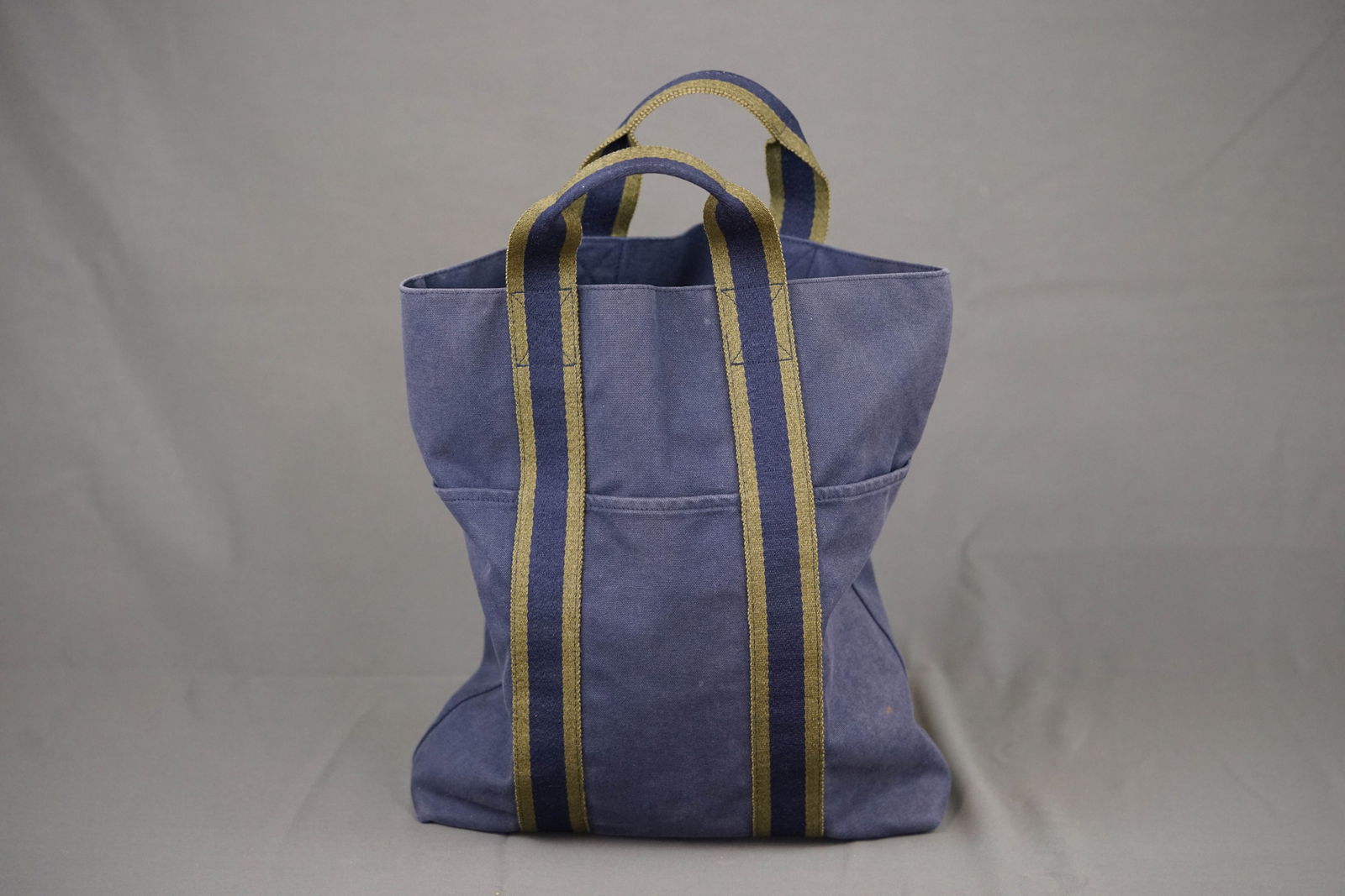 HERMES CANVAS TOTE BAG: HERMES CANVAS TOTE BAG, canvas, width 36cm, height 37 cm, depth7cm. PLEASE NOTE: *This lot is elected for VAT (20%) on the hammer which will not apply for successful bidders outside of the UK