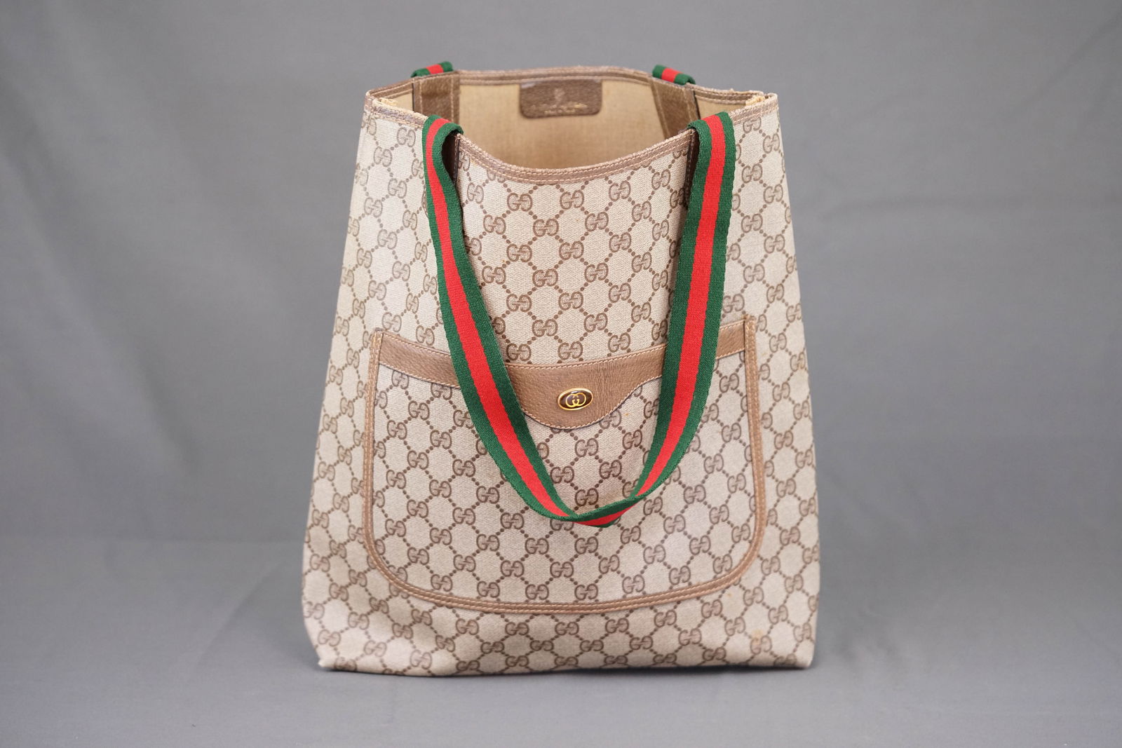 GUCCI MONOGRAM HANDBAG: GUCCI SHOULDER BAG, number 39-02-003, width 34cm, height 36cm, depth 9cm. PLEASE NOTE: *This lot is elected for VAT (20%) on the hammer which will not apply for successful bidders outside of the UK