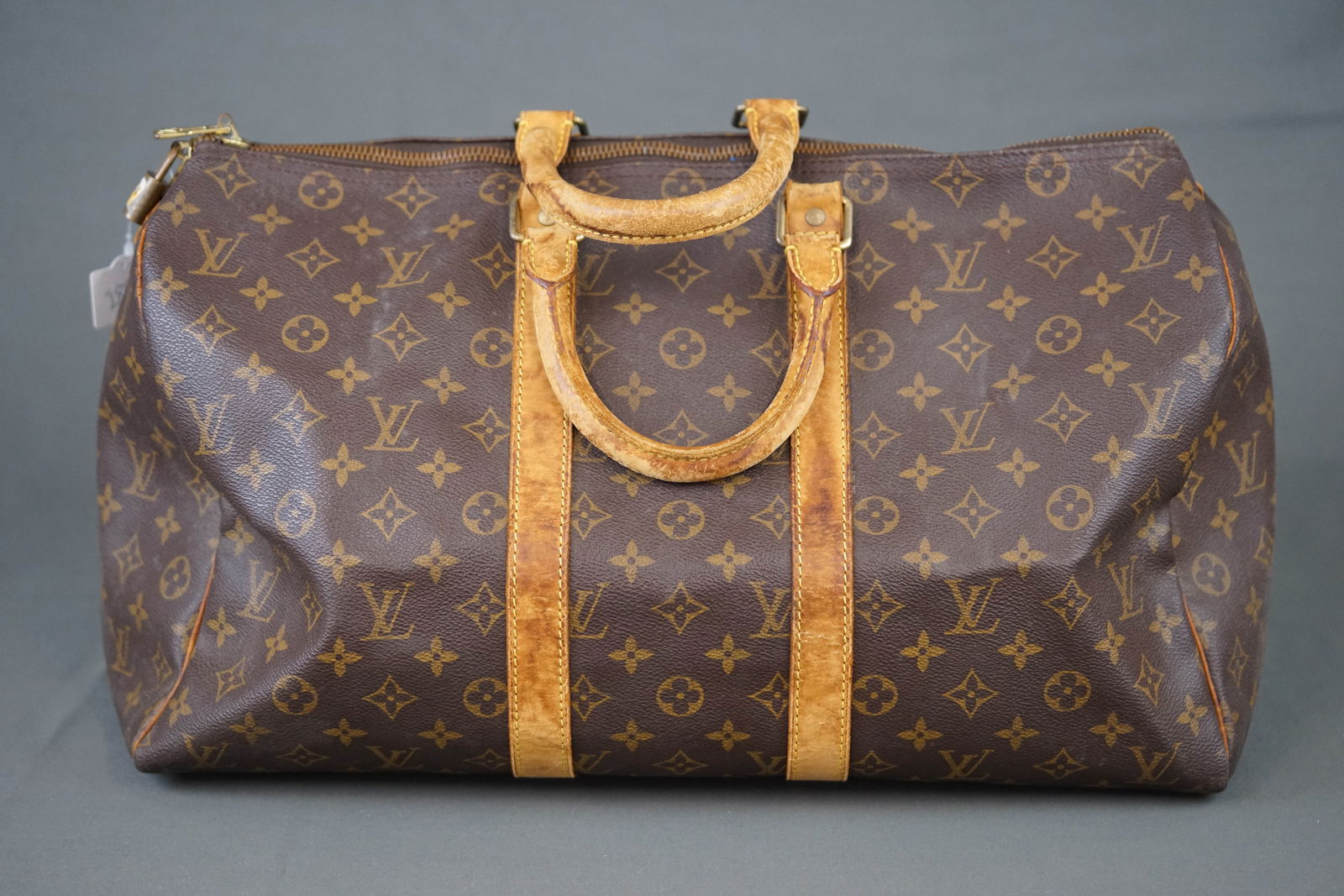 LOUIS VUITTON MONOGRAM HOLDALL 45 BOSTON BAG M41428 SP0998: LOUIS VUITTON MONOGRAM HOLDALL 45 BOSTON BAG M41428 SP0998, handle requires repair, width 45cm, height 23cm, depth 20cm, condition rank: D. PLEASE NOTE: *This lot is elected for VAT (20%) on the