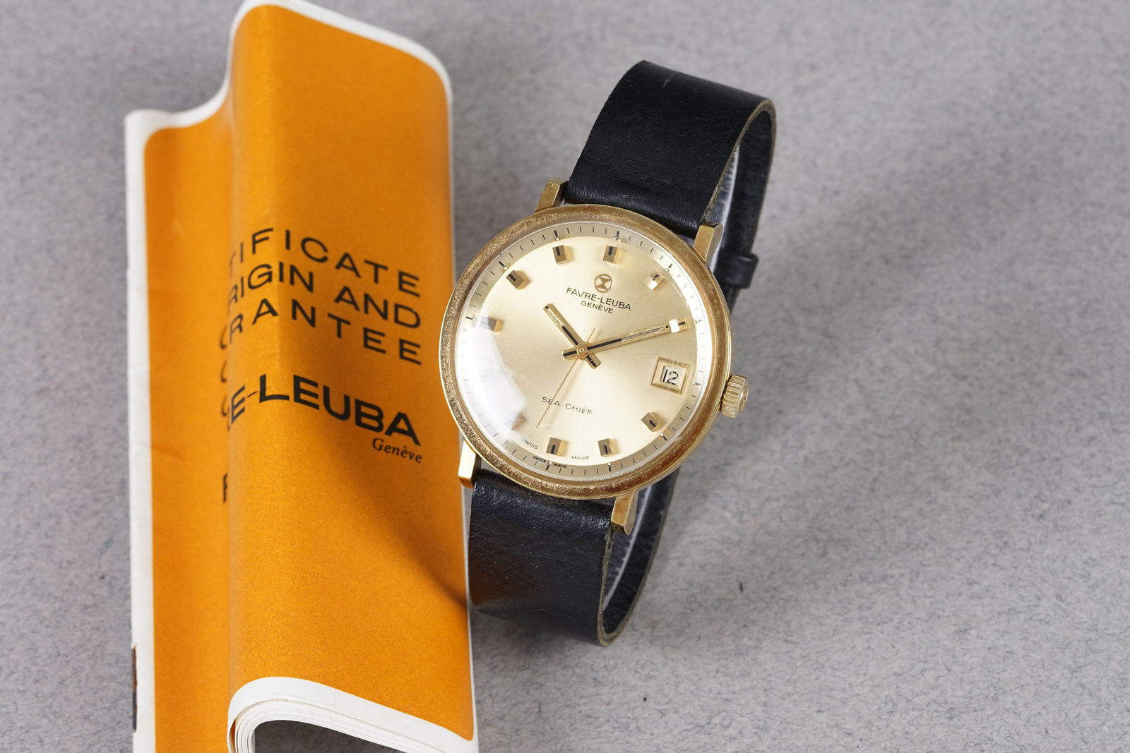 FAVRE LEUBA SEA CHIEF GOLD PLATED W/ GUARANTEE PAPERS: FAVRE LEUBA SEA CHIEF GOLD PLATED W/ GUARANTEE PAPERS, this watch is fitted with a circular champagne dial with a date window, applied hour markers and hands. The 36mm gold plated case is fitted with