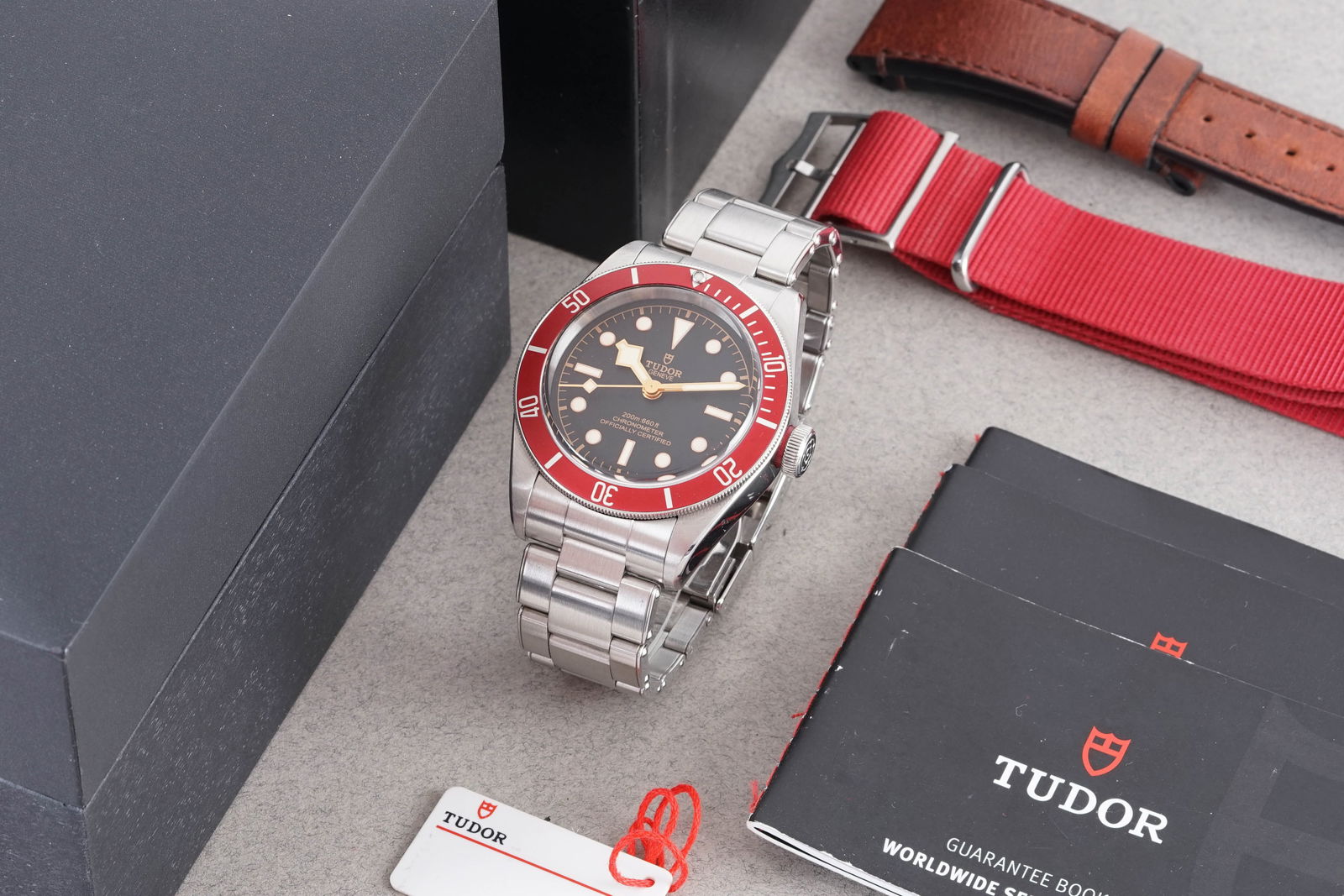 TUDOR BLACK BAY W/ BOX & GUARANTEE BOOKLET REF. 79230: TUDOR BLACK BAY W/ BOX & GUARANTEE BOOKLET REF. 79230, this watch is a ref. 79230 and is fitted with a circular black dial with lume plot hour markers and hands. The 41mm stainless steel case is