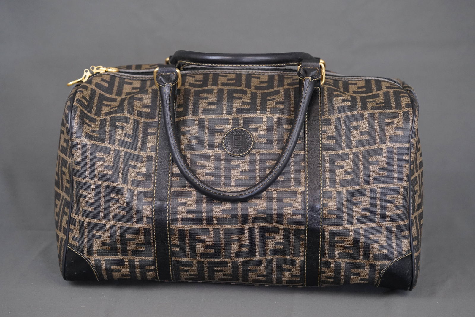 FENDI ZUCCA BOSTON BAG: FENDI ZUCCA BOSTON BAG, width 40cm, height 23cm, depth 16cm. PLEASE NOTE: *This lot is elected for VAT (20%) on the hammer which will not apply for successful bidders outside of the UK (exported). For