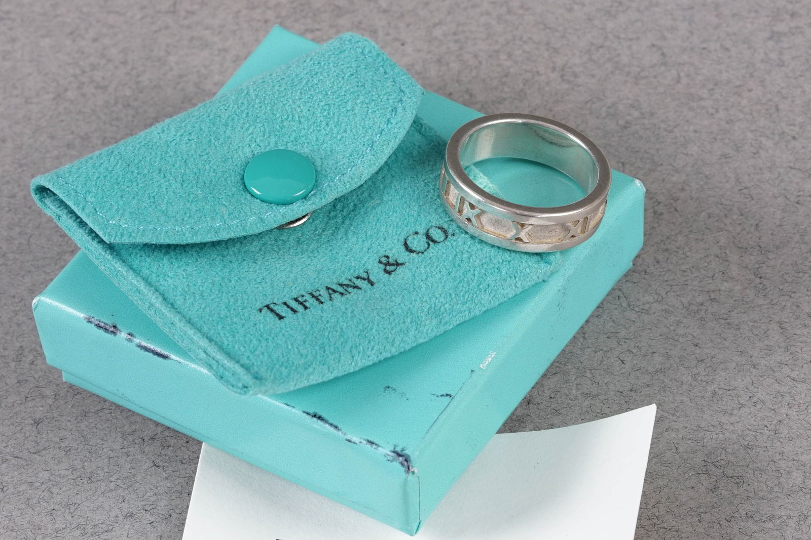 TIFFANY & CO ATLAS RING 925 STERLING SILVER: TIFFANY & CO ATLAS RING 925 STERLING SILVER, ring size 13, 6.2g, w box. PLEASE NOTE: *This lot is elected for VAT (20%) on the hammer which will not apply for successful bidders outside of the UK