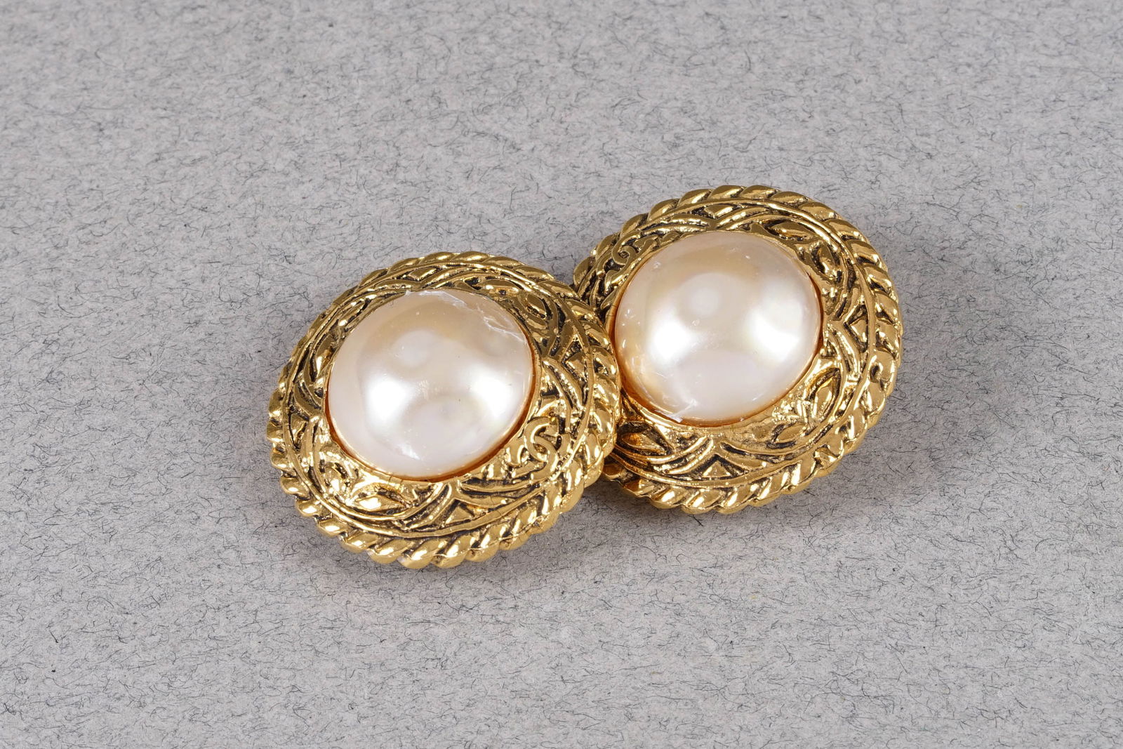 CHANEL EARRINGS: CHANEL GOLD COLOURED AND FAUX PERAL CLIP ON EARRINGS, diameter 3cm ,PLEASE NOTE: *This lot is elected for VAT (20%) on the hammer which will not apply for successful bidders outside of the UK