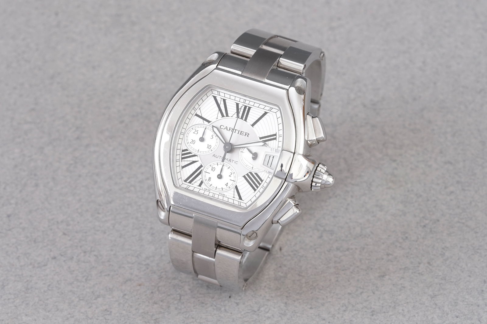 CARTIER ROADSTER CHRONOGRAPH REF. 2618: CARTIER ROADSTER CHRONOGRAPH REF. 2618, this watch is a ref. 2618 and is fitted with a barrel shaped two tone silverdial with hour markers and hands. The 41mm stainless steel case is fitted with