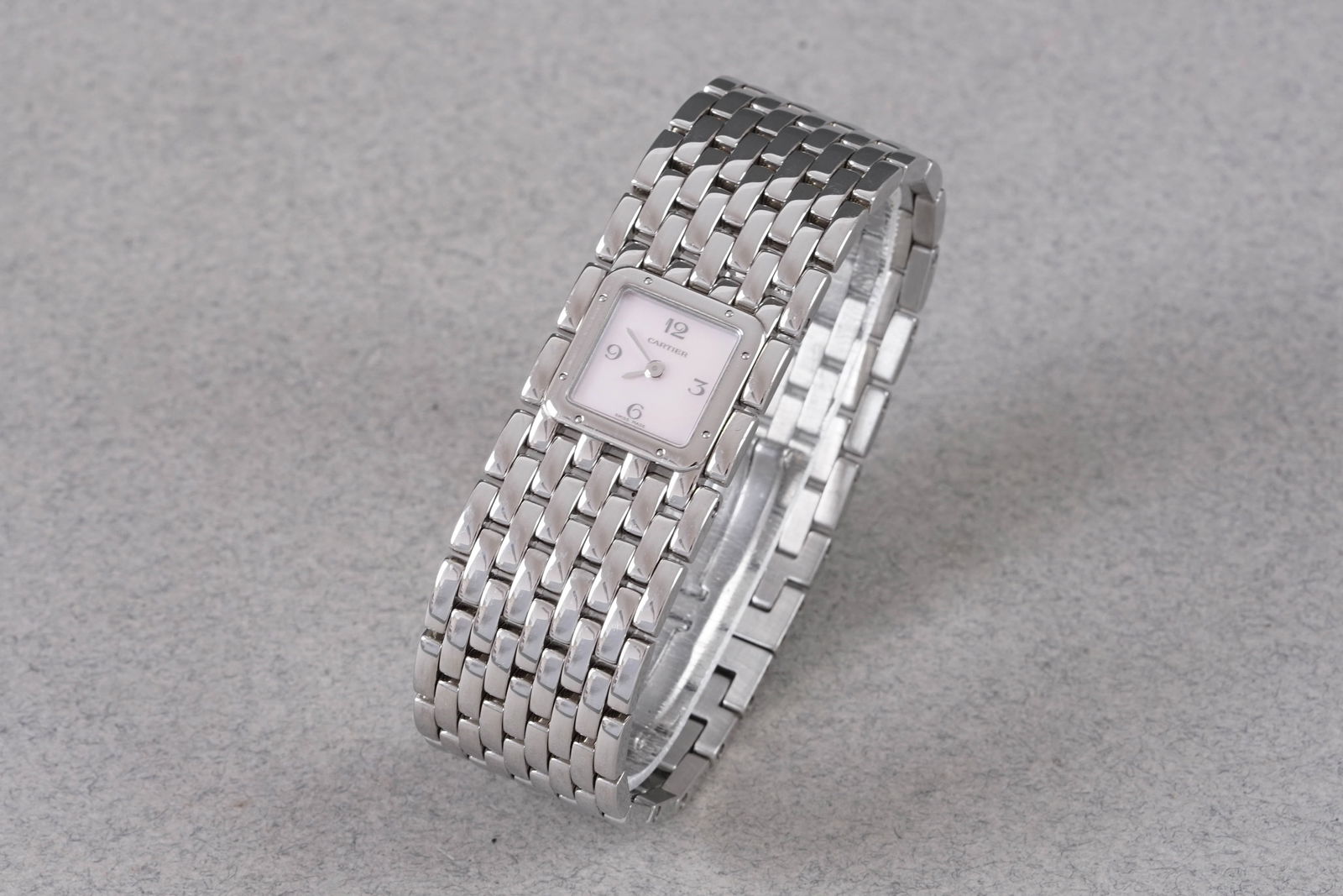 CARTIER PANTHERE RUBAN MOTHER OF PEARL DIAL REF. 2420: CARTIER PANTHERE RUBAN MOTHER OF PEARL DIAL REF. 2420, this watch is a ref. 2420 and is fitted with a square mother of pearl dial with hour markers and hands. The 22mm stainless steel case has a