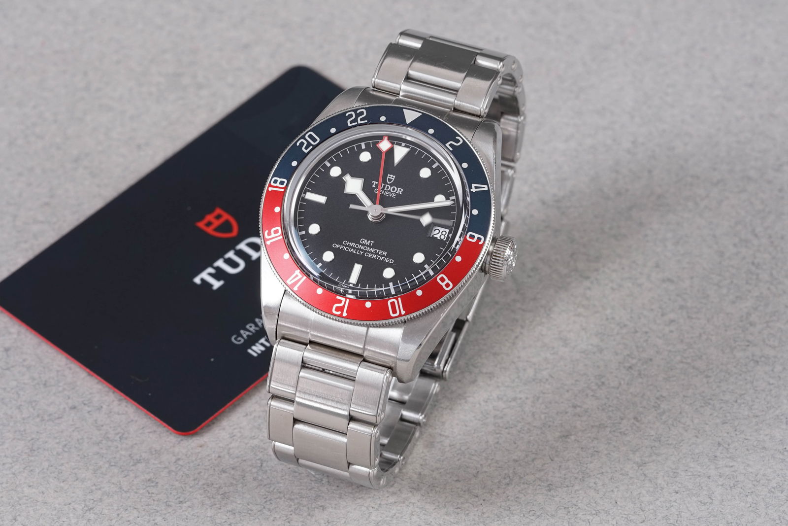 TUDOR HERITAGE BLACK BAY GMT W/ BOX & GUARANTEE CARD REF. 79830RB CIRCA 2022: TUDOR HERITAGE BLACK BAY GMT W/ BOX & GUARANTEE CARD REF. 79830RB CIRCA 2022, this watch is a ref. 79830RB and is fitted with a circular black dial with hour markers and hands. The 41mm