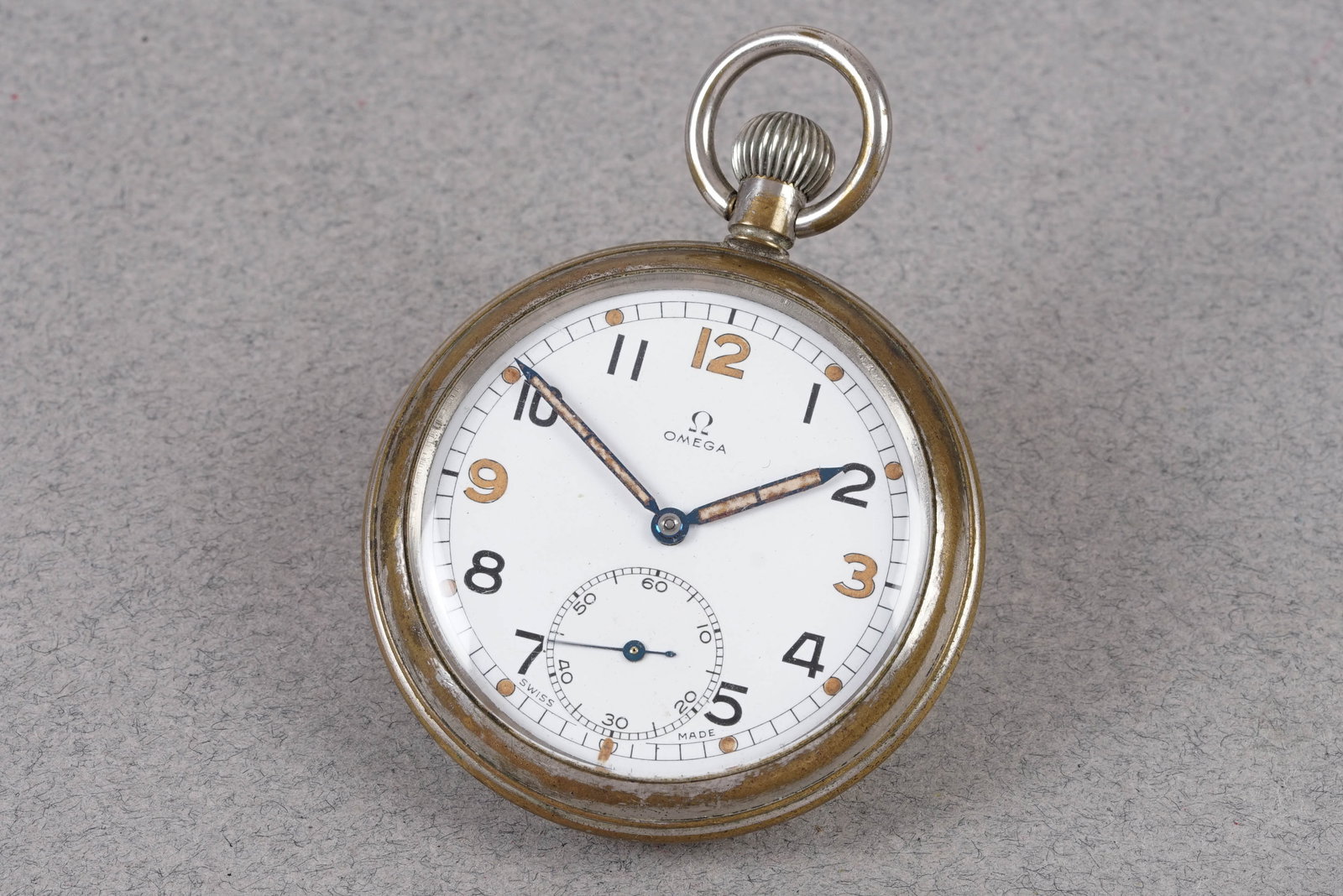 OMEGA BRITISH MILITARY G.S.T.P. POCKET WATCH: OMEGA BRITISH MILITARY G.S.T.P. POCKET WATCH, this watch is a ref. 1140 and is fitted with a white dial, numbered and luminous hour markers and pencil hands. The 55mm steel case is fitted with a crown