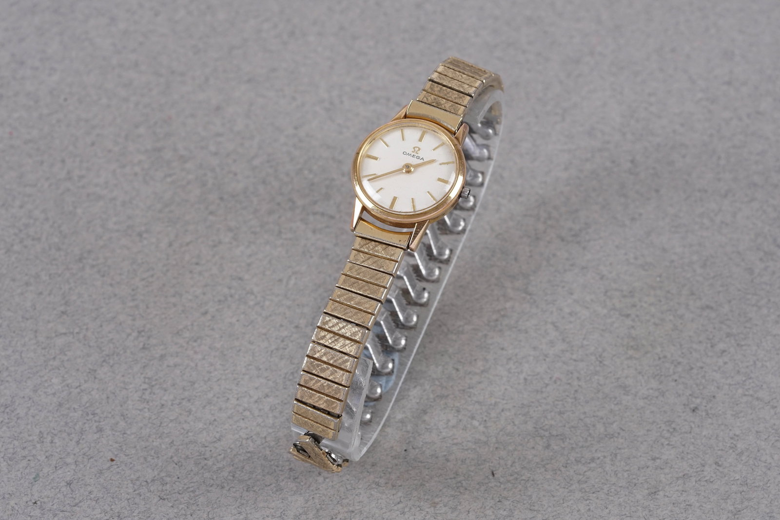 OMEGA GOLD PLATED WRISTWATCH REF. 11083-62: OMEGA GOLD PLATED WRISTWATCH REF. 11083-62, this watch is a ref. 11083-62 and is fitted with a circular silver dial with applied stick hour markers and pencil hands. The 20mm gold plated case is missi