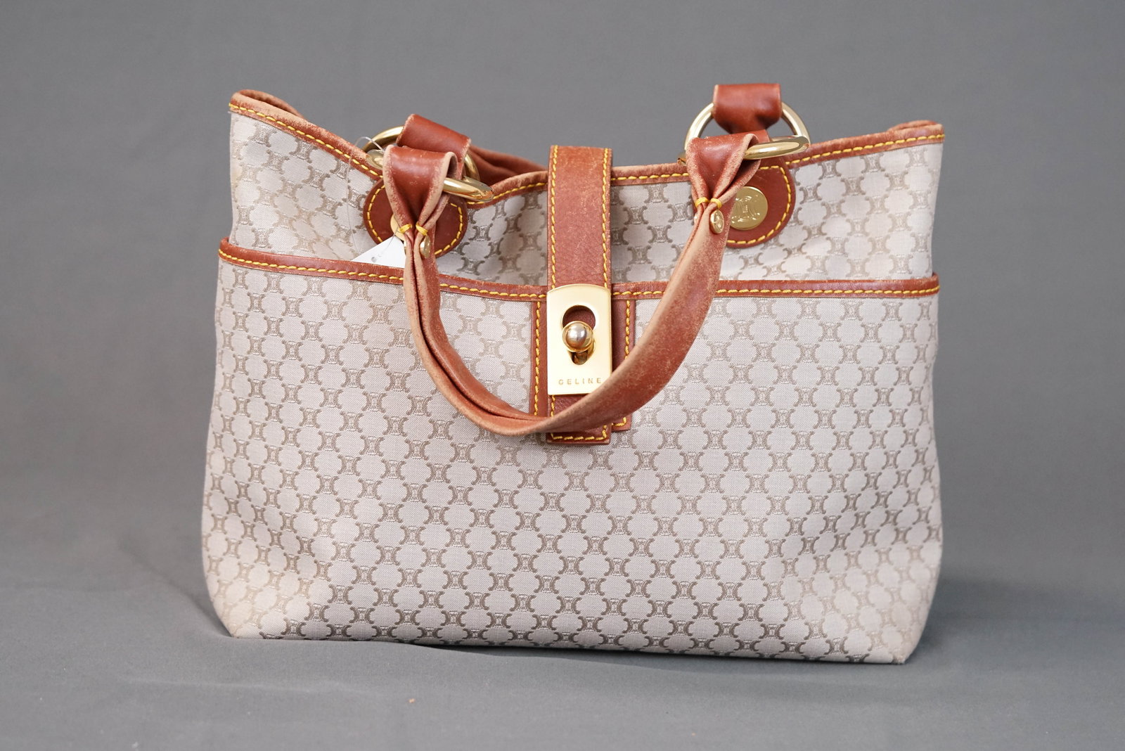 CELINE MACADAM BEIGE CANVAS HANDBAG: CELINE MACADAM BEIGE CANVAS HANDBAG, width 26cm, height 22cm, depth 10cm. If you have any questions regarding this lot please contact us. For further information on our auction, please refer to our T