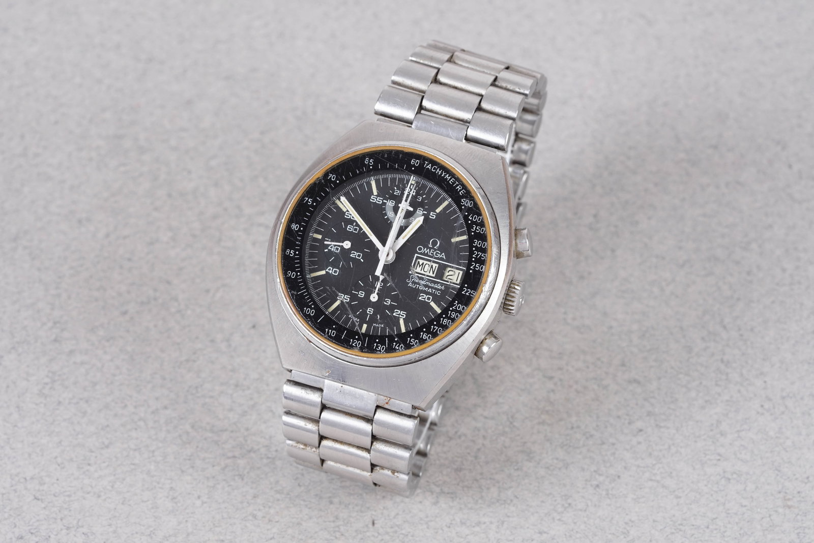 OMEGA SPEEDMASTER MARK 4.5 AUTOMATIC CHRONOGRAPH REF. 176.0012: OMEGA SPEEDMASTER MARK 4.5 AUTOMATIC CHRONOGRAPH REF. 176.0012, this watch is a ref. 176.0012 and is fitted with a round black dial with day/date window, baton hour markers and hands. The tonneau 42mm