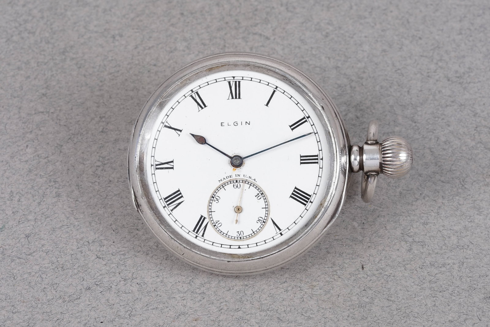 ELGIN 925 STERLING SILVER OPEN FACE POCKET WATCH CIRCA 1928: ELGIN 925 STERLING SILVER OPEN FACE POCKET WATCH CIRCA 1928, white enamel dial, 50mm open faced case, manual wind movement currently running. Gross weight 100.70 grams. If you have any questions regar