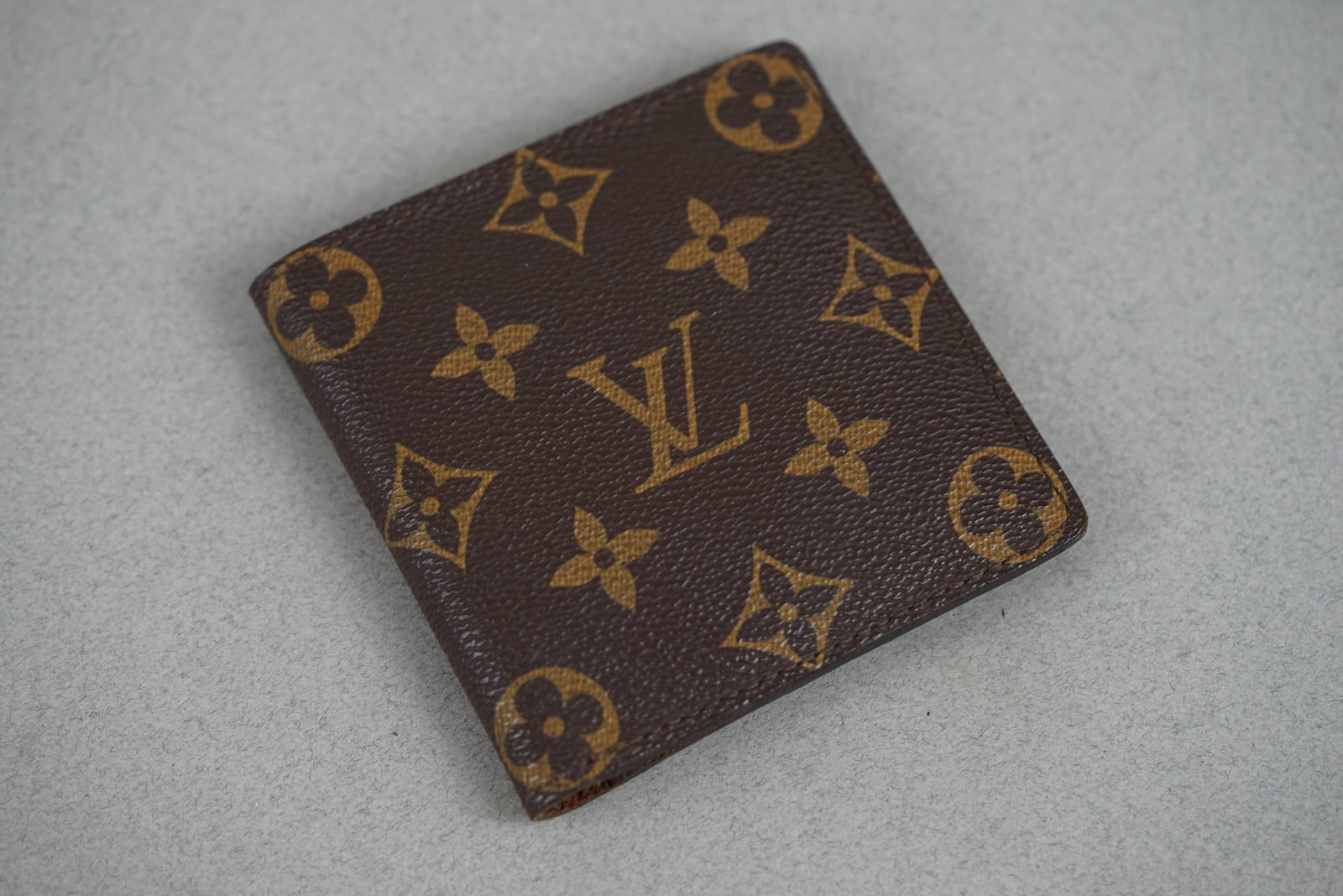 LOUIS VUITTON MONOGRAM WALLET: LOUIS VUITTON MONOGRAM WALLET, width 10cm, height 10cm. If you have any questions regarding this lot please contact us. For further information on our auction, please refer to our T & Cs. We do