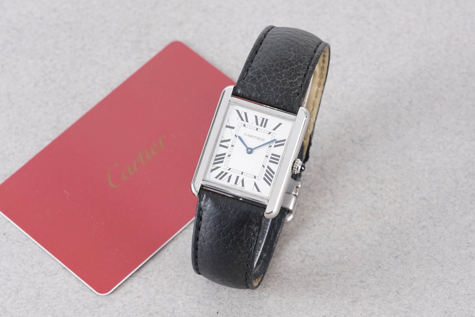 CARTIER TANK SOLO W/ GUARANTEE CARD REF. 3169 CIRCA 2019: CARTIER TANK SOLO W/ GUARANTEE CARD REF. 3169 CIRCA 2019, this watch is a ref. 3169 and is fitted with a rectangular dial with roman numeral hour markers and hands. The 27x35mm stainless steel case