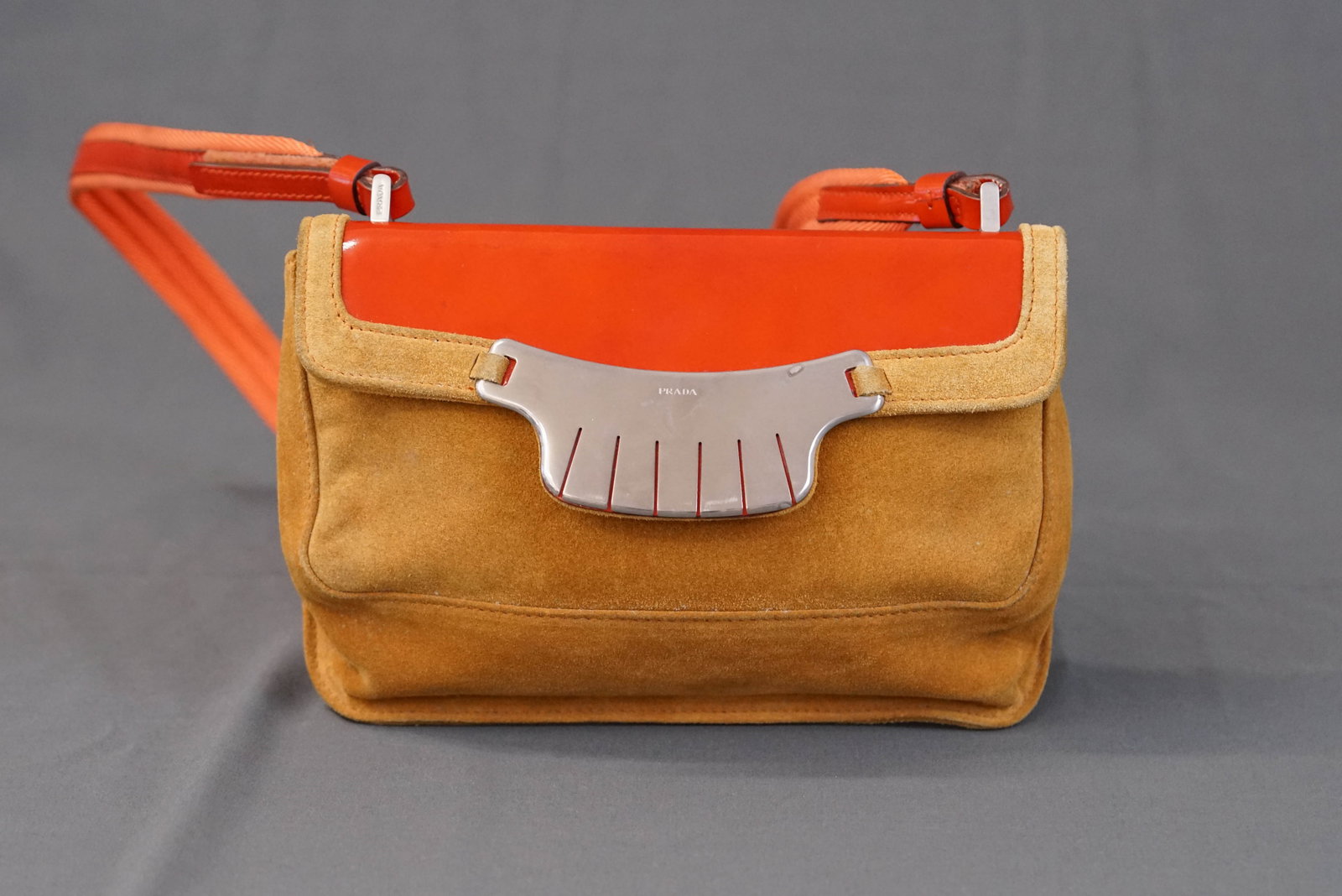 PRADA SUEDE NAVAJO STYLE SHOULDER BAG: PRADA SUEDE NAVAJO STYLE SHOULDER BAG, condition rank BC, width 20cm, height 13cm, depth 5cm. Comes with authentication card If you have any questions regarding this lot please contact us. For