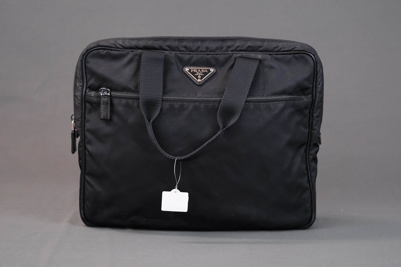 PRADA POCONO BLACK NYLON HANDBAG: PRADA POCONO BLACK NYLON HANDBAG, width 33cm, height 33cm, depth 5cm. If you have any questions regarding this lot please contact us. For further information on our auction, please refer to our T
