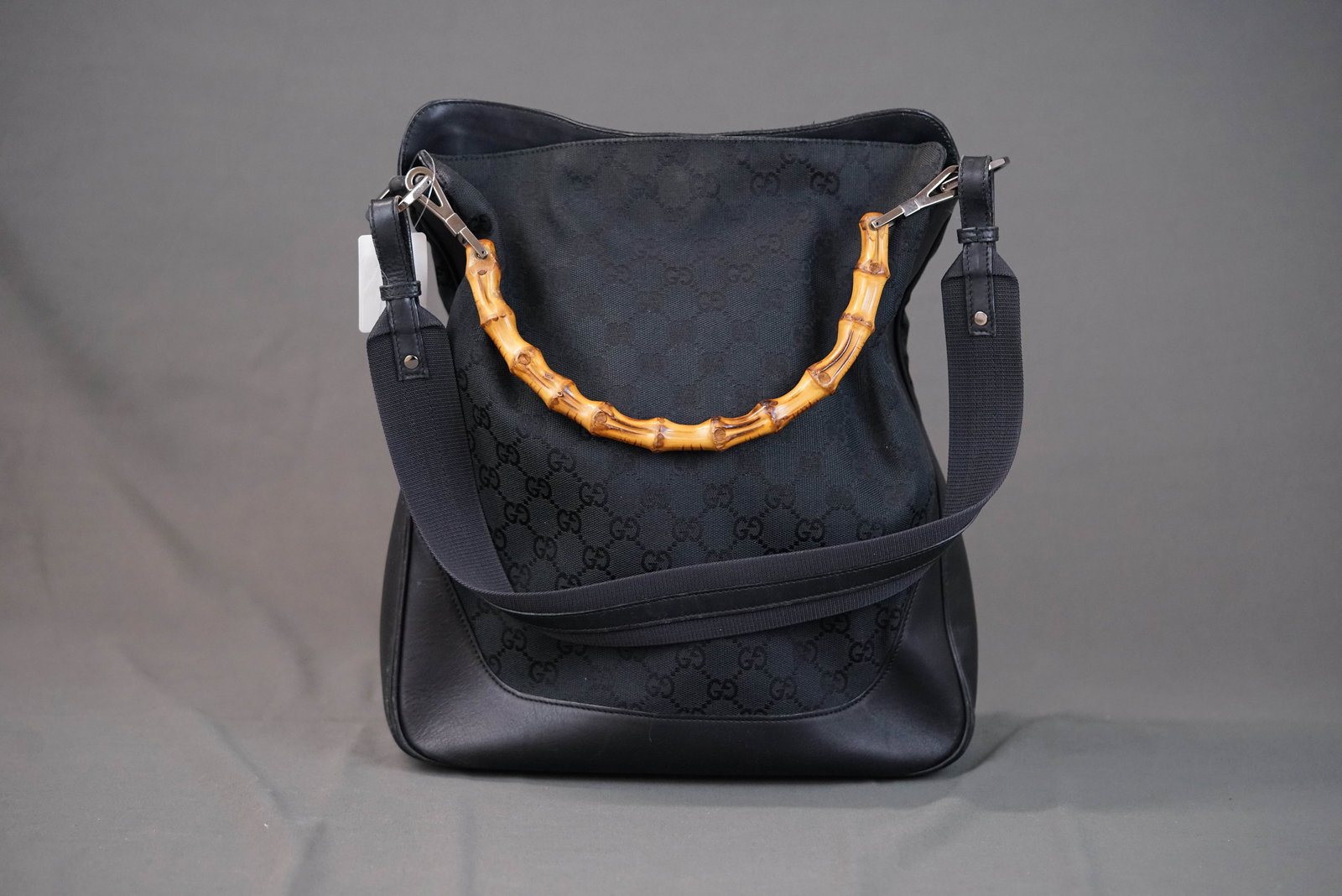 GUCCI GG BAMBOO CANVAS HANDBAG 1705 BLACK: GUCCI GG BAMBOO CANVAS HANDBAG 1705 BLACK, width 29cm, height 33cm, depth 9cm. If you have any questions regarding this lot please contact us. For further information on our auction, please refer to