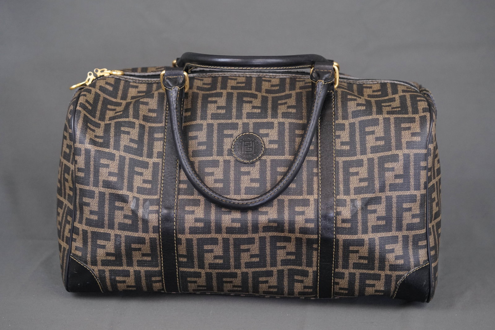 FENDI ZUCCA BOSTON BAG: FENDI ZUCCA BOSTON KEEPALL BAG, width 40cm, height 23cm, depth 16cm. If you have any questions regarding this lot please contact us. For further information on our auction, please refer to our T