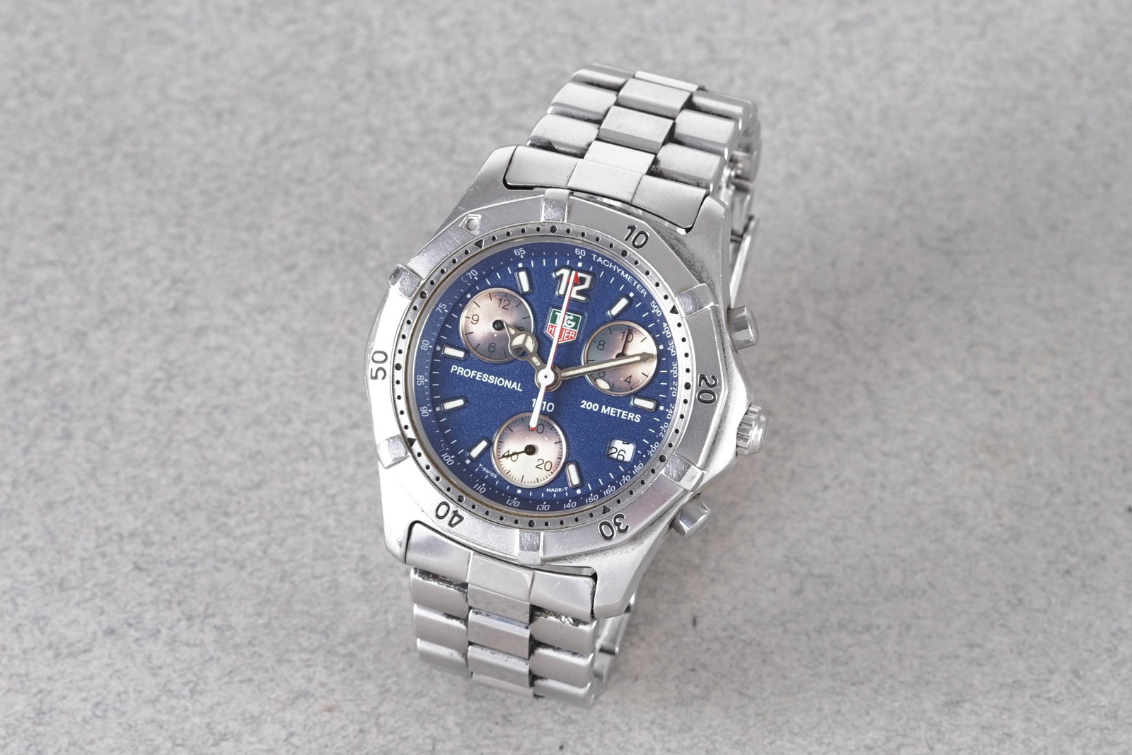 TAG HEUER PROFESSIONAL CHRONOGRAPH REF. CK1112: TAG HEUER PROFESSIONAL CHRONOGRAPH REF. CK1112, this watch is a ref. CK1112 and is fitted with a circular blue triple register dial with luminous hour markers and hands. The 37mm stainless steel case 