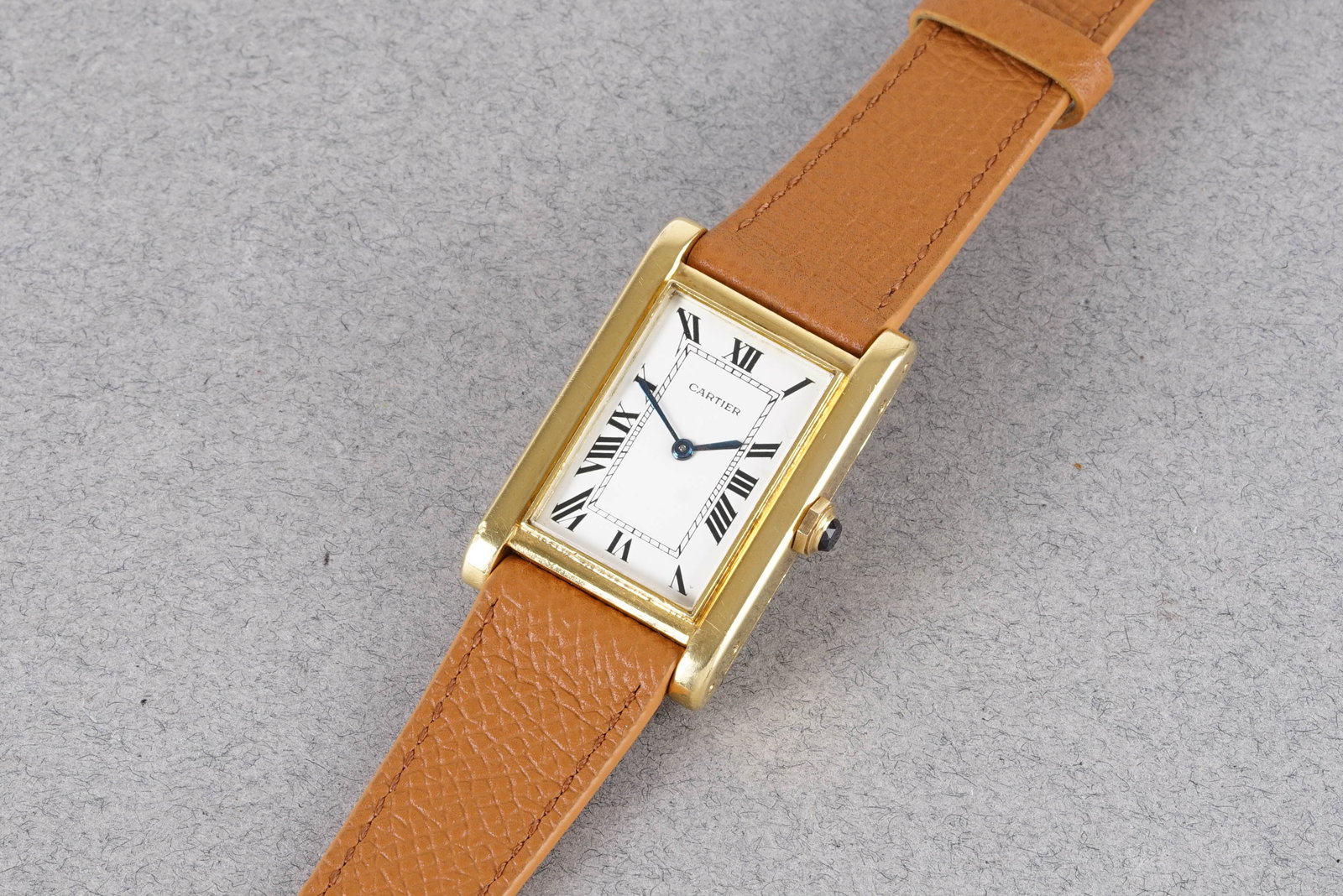 EXCEEDINGLY RARE CARTIER TANK MAGNUM XL EDOUARD JAEGER 18CT YELLOW GOLD CIRCA 1931: EXCEEDINGLY RARE CARTIER TANK MAGNUM XL EDOUARD JAEGER 18CT YELLOW GOLD CIRCA 1931, this watch is fitted with a rectangular white dial with hour markers and hands. The 25x37.5mm 18ct gold case is